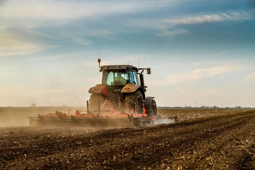 A tractor ploughing a field